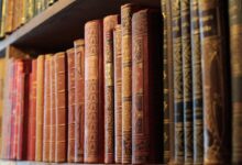 Old books on wooden shelves