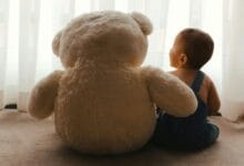 baby with a teddy toy